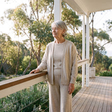 Woman in a soft matching set at the verandah railing